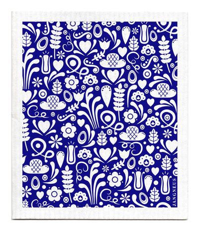 Pattern assortment of white leaves, flowers (multiple shapes), hearts, squiggles on a blue background.